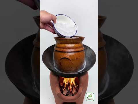 An old-fashioned earthenware pot used for cooking food with steam. thumbnail