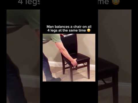 Man balances a chair on all 4 legs at the same time ? #shorts thumbnail