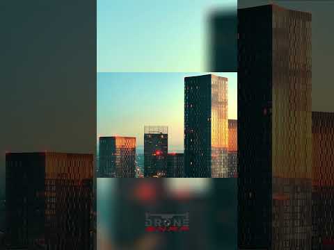 City's Golden Hour: Skyscrapers Illuminated by Sunrise/Sunset #shorts thumbnail