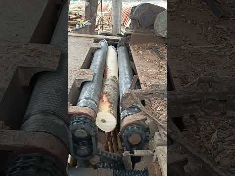 The process of rotary cutting bark- Good tools and machinery make work easy thumbnail