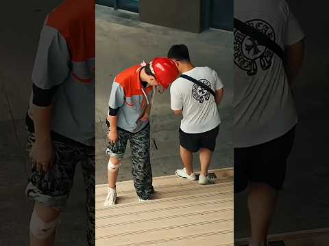 The man quietly carrying an ịnured worker up the stairs. #short,#kindness,#help,#love thumbnail
