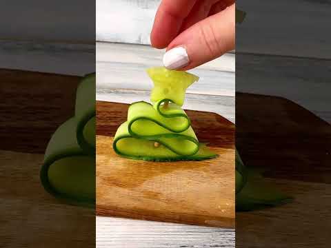 Cucumber Christmas tree like a snow globe. Perfect holiday decor! #ChristmasDIY #FoodArt #SnowGlobe thumbnail