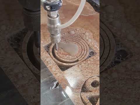 Cut the ring in the tile with a water knife- Good tools and machinery make work easy thumbnail
