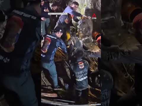 Rescuers pull out first survivor from flooded Laos cave thumbnail
