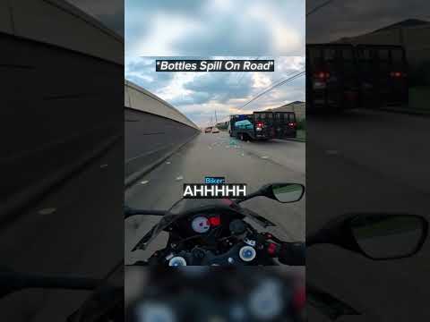 Biker Dodges Water Bottles While Cruising... thumbnail