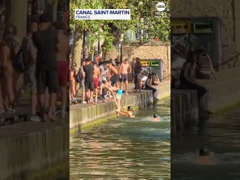 Parisians ignore ban and jump into canal during heatwave thumbnail