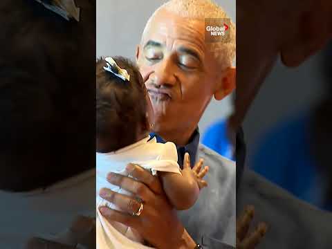 Barack and Michelle Obama greet visitors at opening of his presidential center in Chicago thumbnail