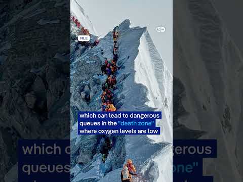 Mount Everest hits record single-day summit numbers from Nepal side | DW News thumbnail