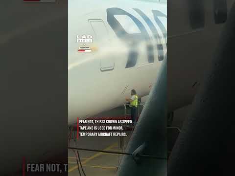 Putting tape on a plane just before take off thumbnail