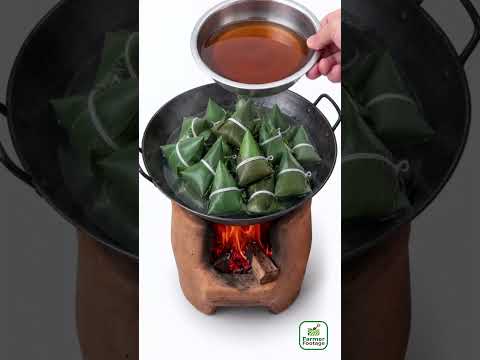 Boil the glutinous rice balls in water infused with wood ash. thumbnail