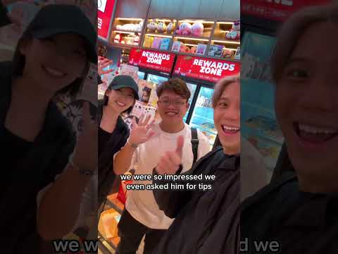 Young people buying groceries from claw machines? thumbnail