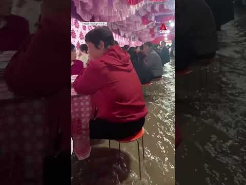 China wedding banquet carries on despite ankle-deep floodwaters thumbnail