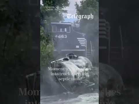 Train crashes into truck carrying septic tank thumbnail