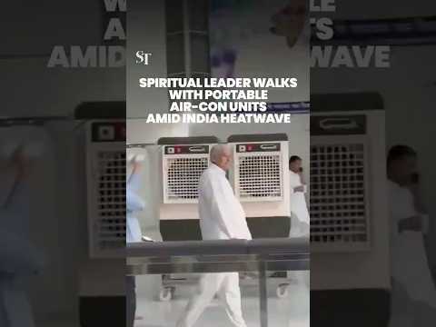 Spiritual leader in India walks around with his own air-conditioning units amid heatwave thumbnail