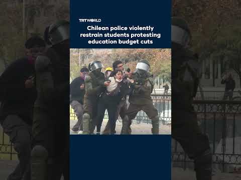 Chilean police violently restrain students protesting education budget cuts thumbnail