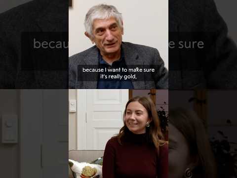Nobel Prize laureate John Martinis talks medals, real and chocolate, with student Eleonora Svanberg. thumbnail