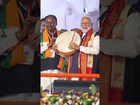 PM Modi plays an instrument at Hyderabad rally thumbnail