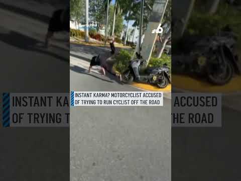 Instant karma? Motorcyclist accused of trying to run cyclist off the road thumbnail