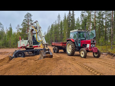 Fixing Excavator and Hauling Sand to Repair Forest Road thumbnail