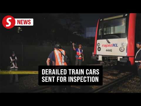 Four derailed train cars in depot for inspection thumbnail