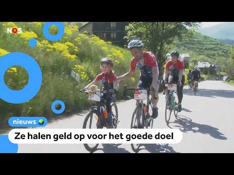 Mensen lopen en fietsen hoge berg op voor Alpe d'HuZes thumbnail