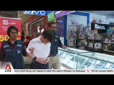 Six men accused of fraudulently registering SIM cards to commit scams taken back to crime scenes thumbnail