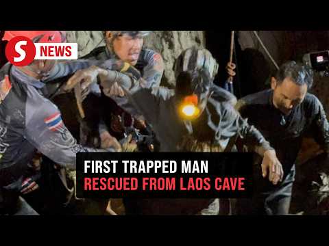 Rescuers pull out first trapped person from flooded Laos cave thumbnail