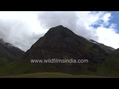 Clouds Drifting Across the High-Altitude Peaks of Harsil Valley in the Himalayas thumbnail