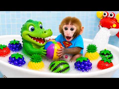 Monkey Baby Bon Bon plays soccer with dinosaurs and takes a bath in a tub full of colorful race cars thumbnail