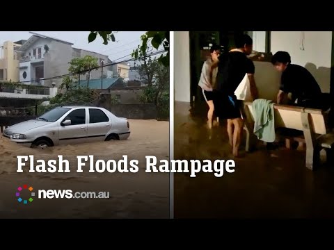 Flash floods swamp cars and flood houses in Vietnam thumbnail