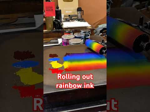 Rolling out 4 colors of ink (to create 6) with a brayer on an ink stone for letterpress printing. thumbnail
