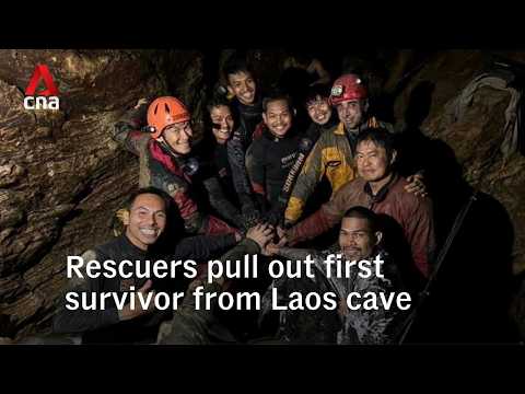 Rescuers evacuate the first of 5 villagers found trapped in a cave in Laos thumbnail