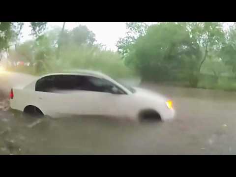 Cops Rescue Baby From Car Swept Up In Floodwater During Storm thumbnail