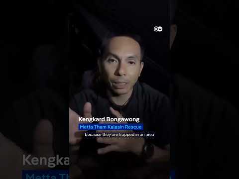 Divers race to rescue villagers trapped in flooded Laos cave | DW News thumbnail