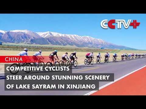 Competitive Cyclists Steer Around Stunning Scenery of Lake Sayram in Xinjiang thumbnail