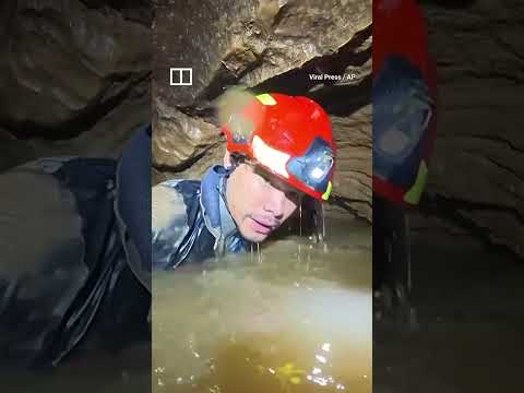 Rescuers race to save miners in flooded Laos cave thumbnail