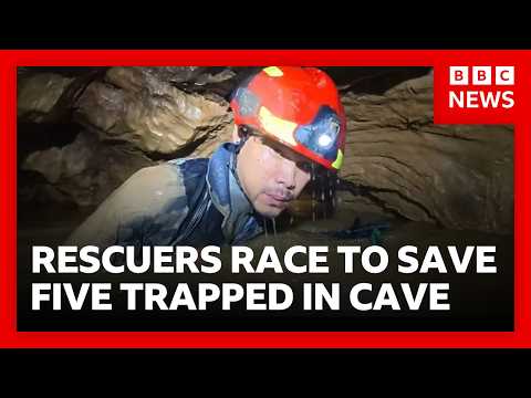 Rescuers race to free five people trapped in flooded cave in Laos | BBC News thumbnail