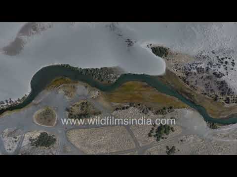 Turquoise river winding through fabulous Ladakh sand dunes and barren Himalayan landscape thumbnail