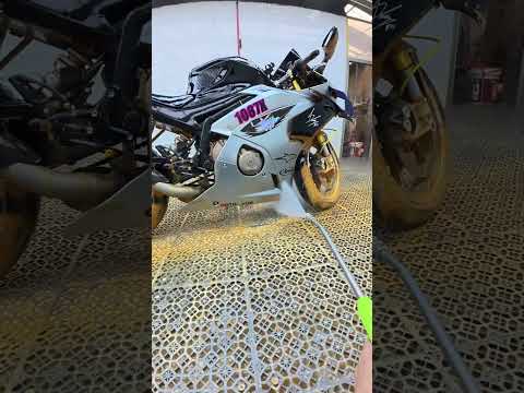 Washing a motorcycle covered in mud. thumbnail