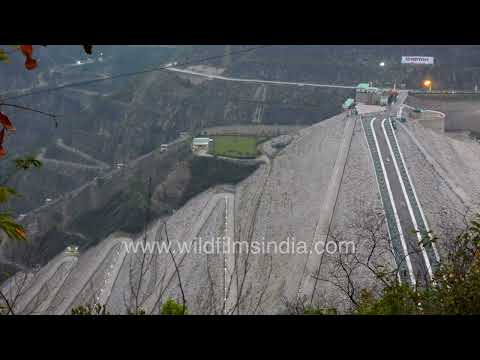 Tehri Dam dominates the Himalayas with massive spillways and mountain roads thumbnail