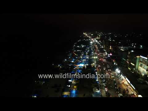 Glowing nighttime coastline of Puri Beach along the Bay of Bengal in Odisha India thumbnail