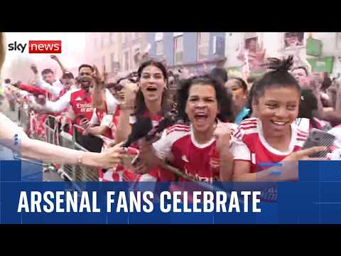 Thousands of Arsenal fans line the streets of North London for Premier League trophy parade thumbnail