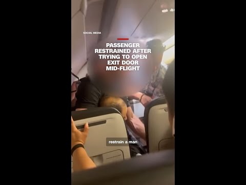 Passenger restrained after trying to open exit door mid-flight thumbnail