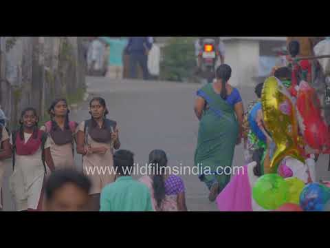 Busy street scene in Valparai hill station Tamil Nadu thumbnail