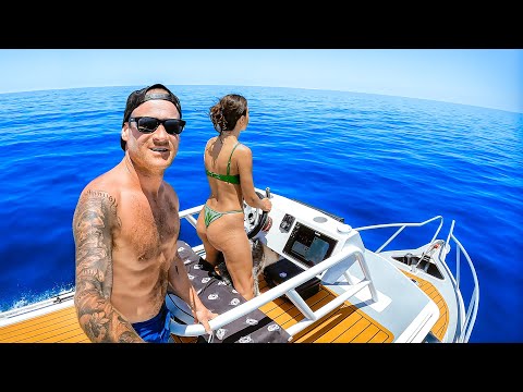 Boat Camping In Rare Solar Eclipse On Remote Ocean thumbnail