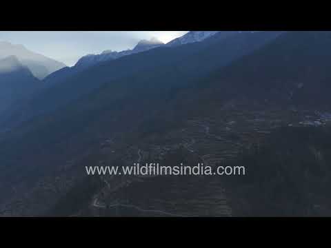 Golden sunrise above the terraced hills of the Garhwal Himalaya thumbnail