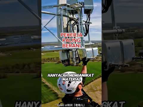 pekerja memasang ratusan meter antena diudara. thumbnail
