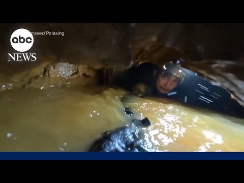 Laos cave rescuers hear 'knocking' in race to find last two trapped villagers thumbnail