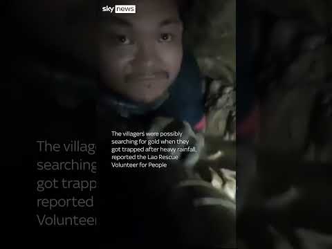 Rescuer crawls through cave tunnel to reach trapped villagers thumbnail