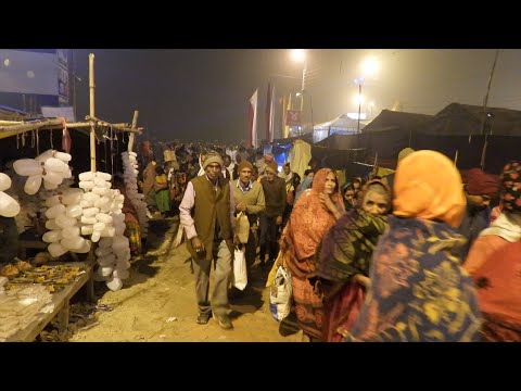 Devotional crowds and festive lights at Gangasagar Mela India thumbnail